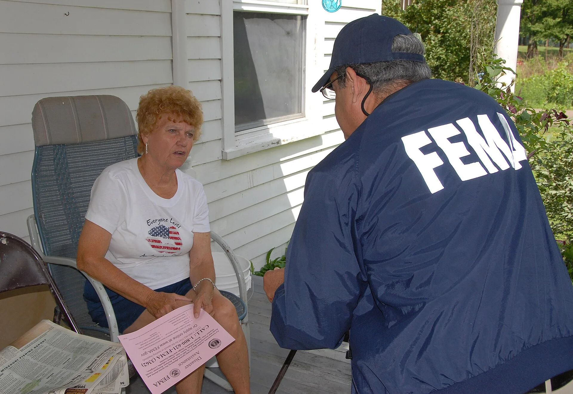 Agency, MO, 6-23-07 -- FEMA Community Relations Specialist Luis Miranda talks with Dorothy Lavnick who received her FEMA housing check in 5 days, but now needs to fill out her SBA loan application to be considered for other FEMA aid. Community Relation Specialists are out in the flood damaged area t. SBA loans requirements: programs, forms and eligibility