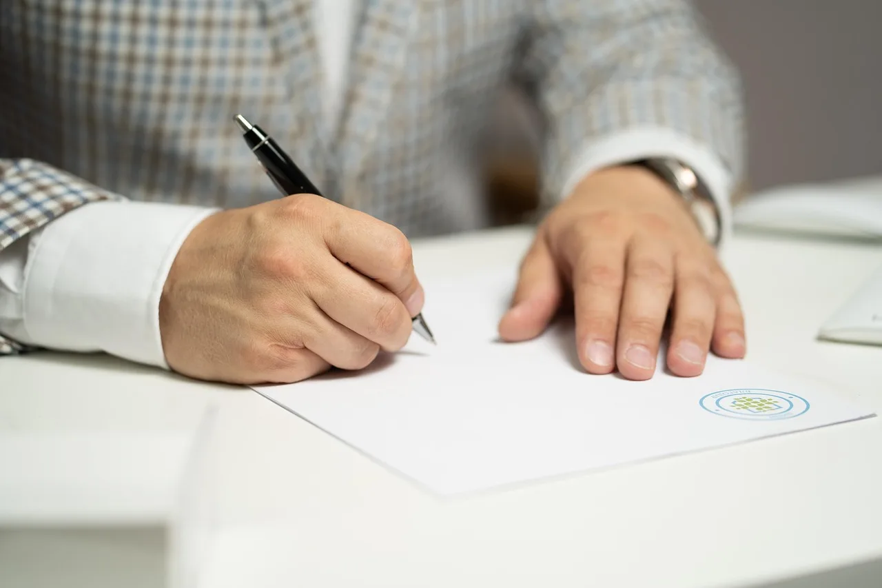 man, sign, paper, write, document, contract, signing, agreement, signature, signing document, signing contract, signing paper, sign, contract, contract, contract, contract, contract, signing, agreement, signature, signature. Small business loans in Canada: security, documents and timing